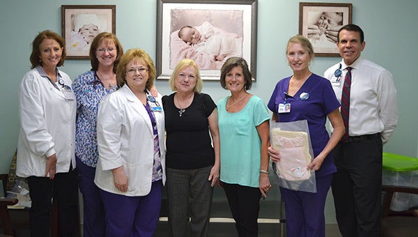 Shown from left are Melissa Davis, Cathy Dewrell, Melinda Bush, Linda Trent, Anne Hudson, Pat Pippin, and John Yanes. 