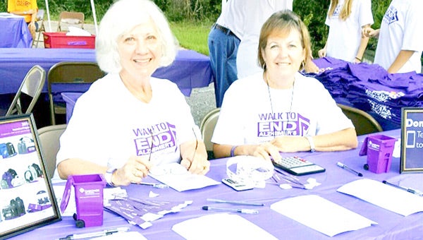  Theresa Chandler and Janice Hornsby man the registration table.